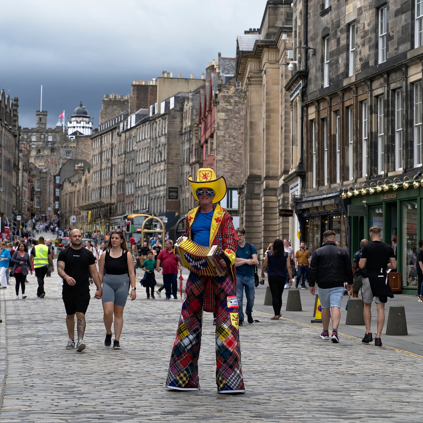 A street performer in tartan on the Royal Mile during the Edinburgh Festival Fringe