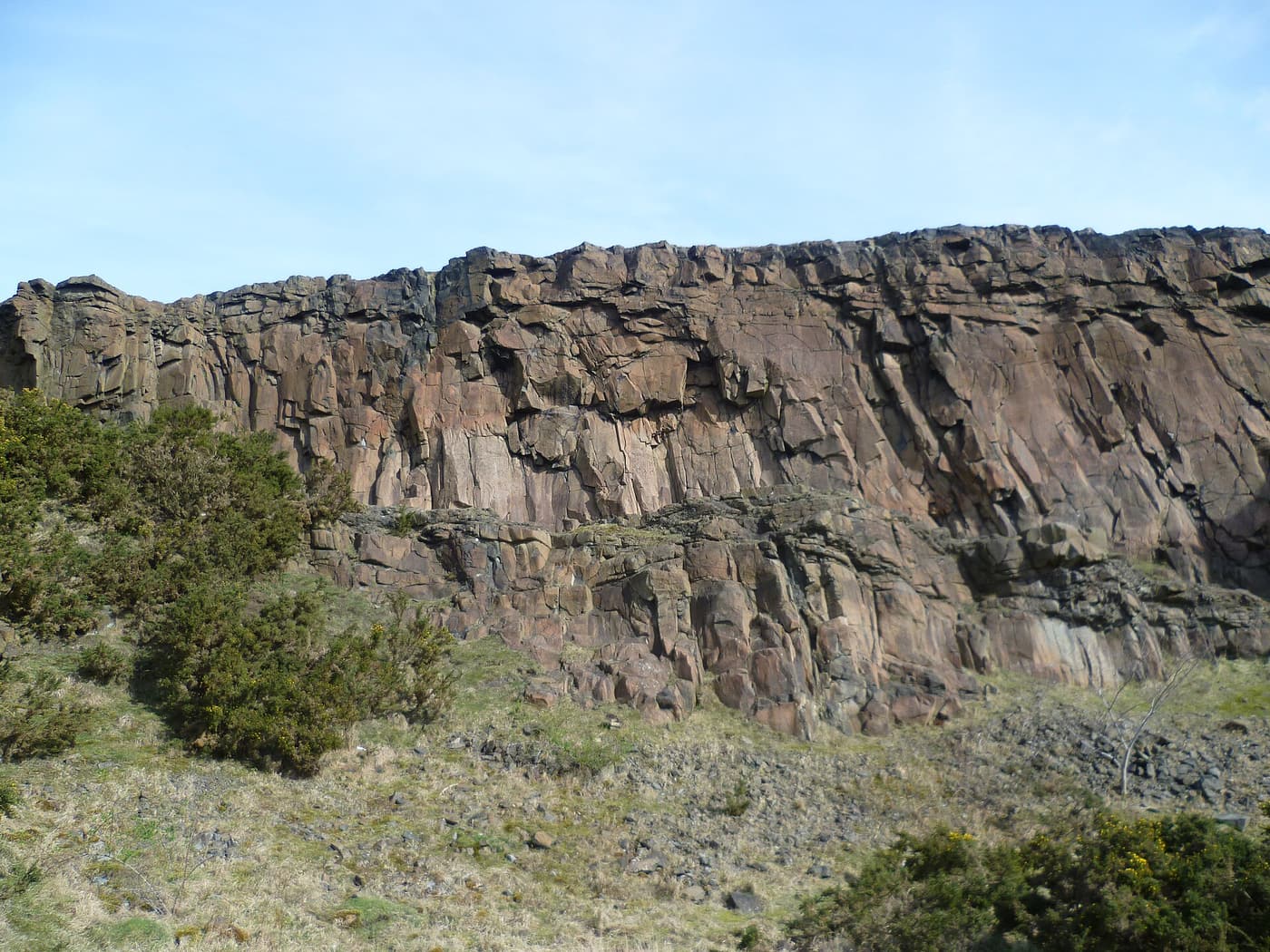 The rock face at Hutton’s Section on Salisbury Crags, where dark dolerite meets paler sandstone