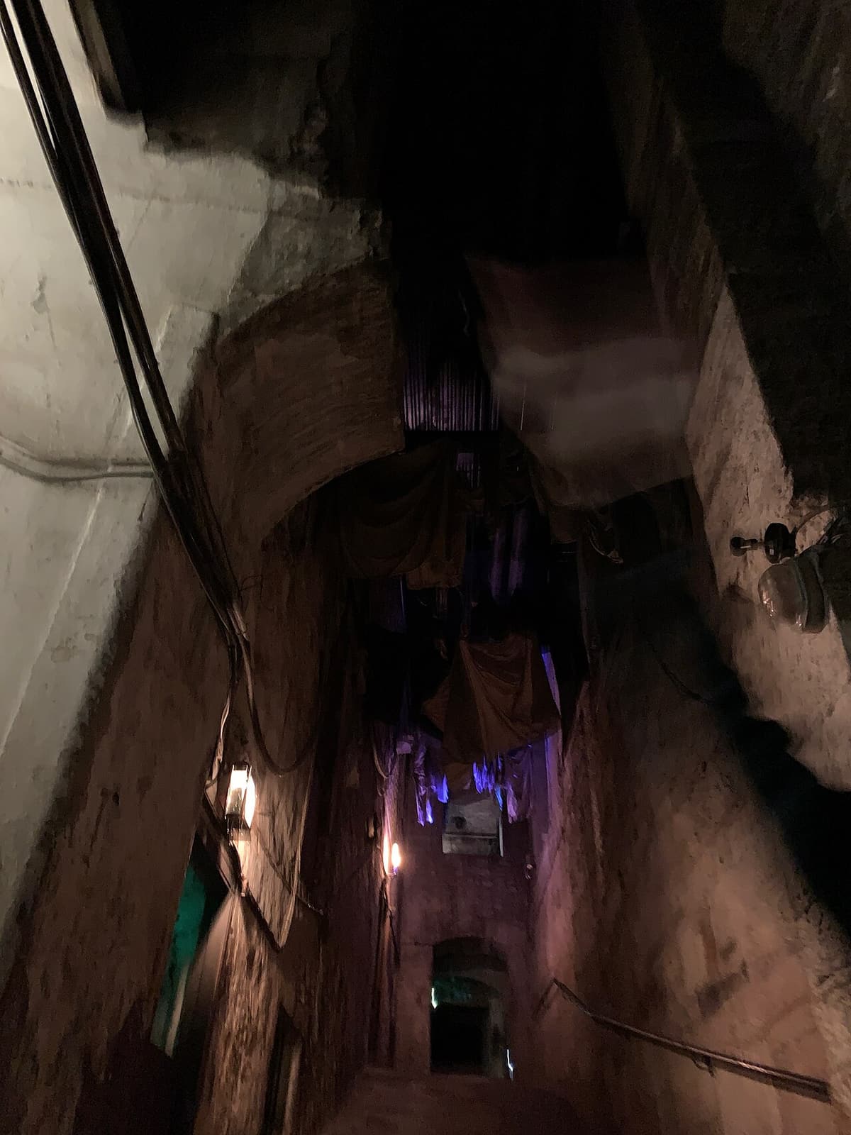 A dim, narrow stone passage in the preserved underground street of Mary King’s Close