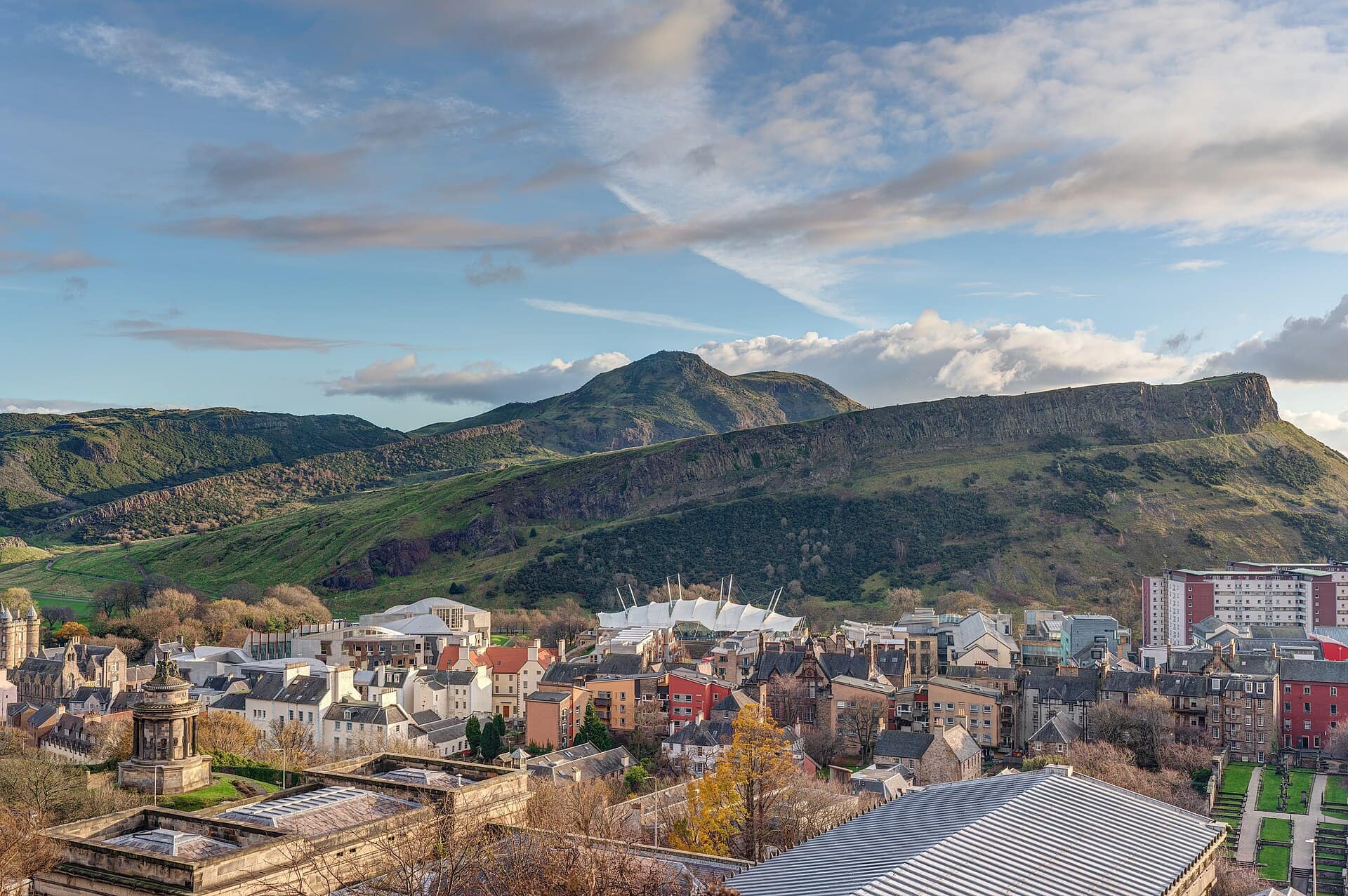 Arthur’s Seat and Salisbury Crags rising above the rooftops of Edinburgh, seen from Calton Hill